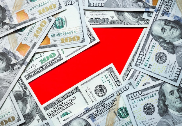 Photo red arrow pointer and dollars