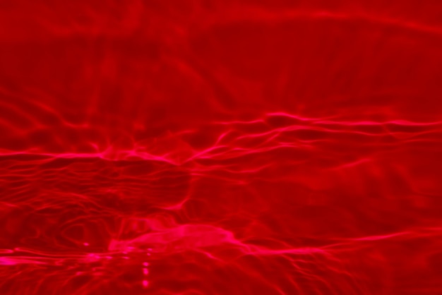 Red background with light reflecting on the water