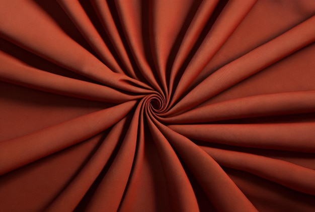 A red background with a spiral in the middle.