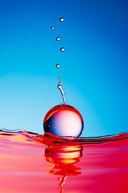 Red ball floating in the water with blue sky background generative ai