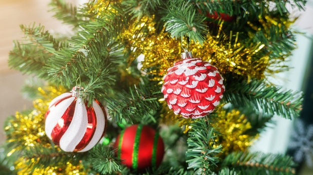 Red ball hanging on a Christmas tree