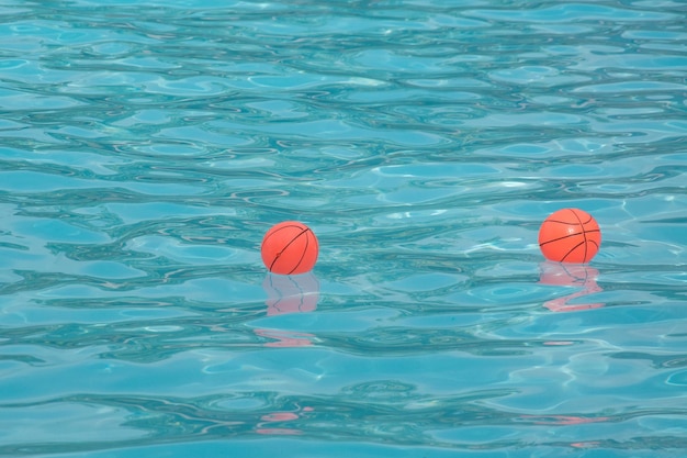 Red ball in water pool