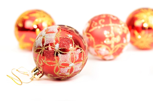 Red balloons to decorate a Christmas tree on a white background