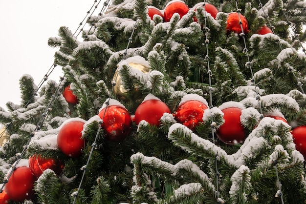 Red balls on a street Christmas tree