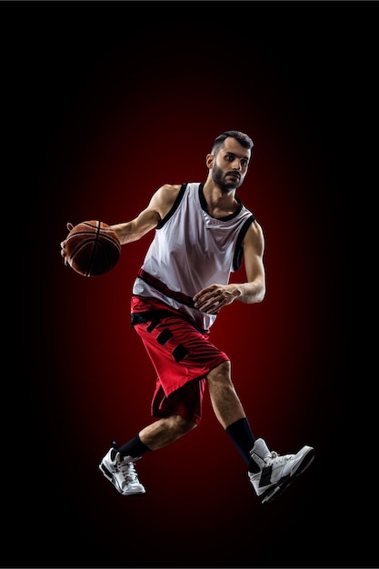 Red Basketball player in action in gym