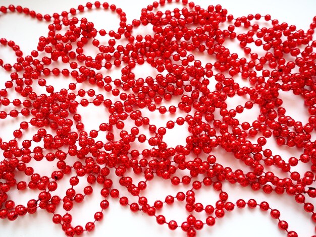 Photo red beads. decorative decoration. women's jewelry. beautiful shiny bright scarlet beads. fashion background.