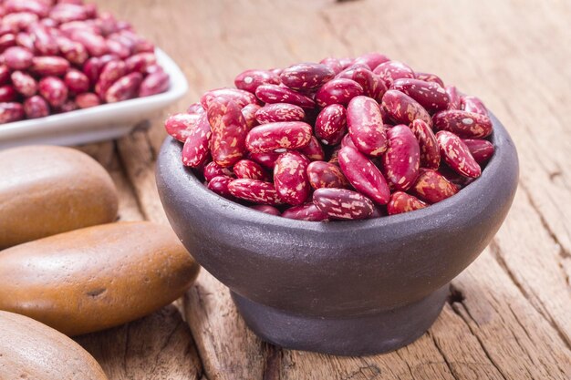 Red bean in bowl on the table Phaseolus vulgaris