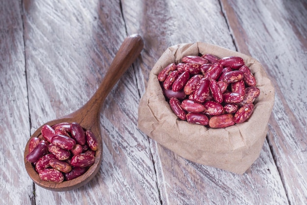 Red bean in bowl on the table Phaseolus vulgaris