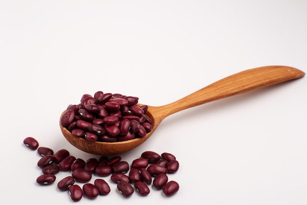 Red beans in wooden spoon