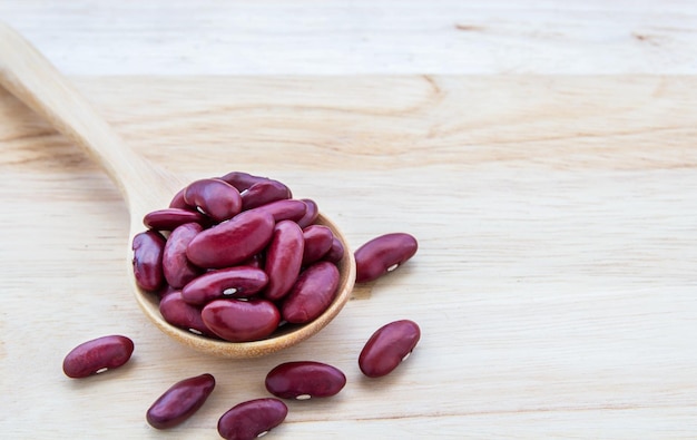 Red beans in wooden spoon