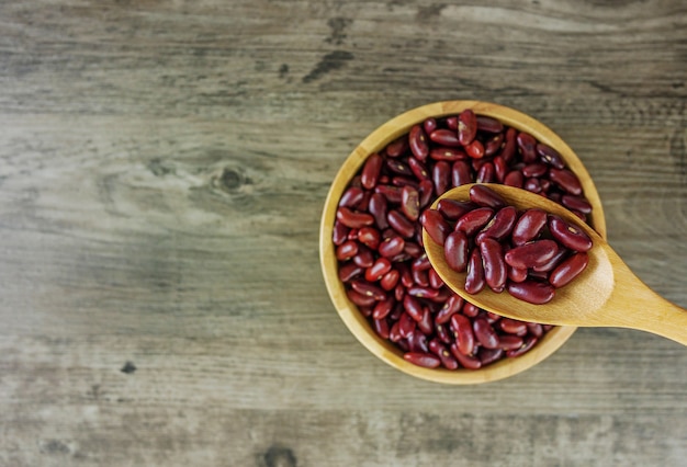 Red beans on wooden table and copy space