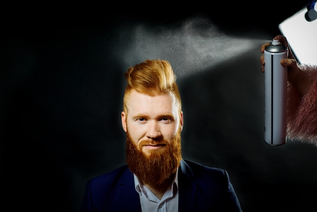 Red bearded stylish barber shop client