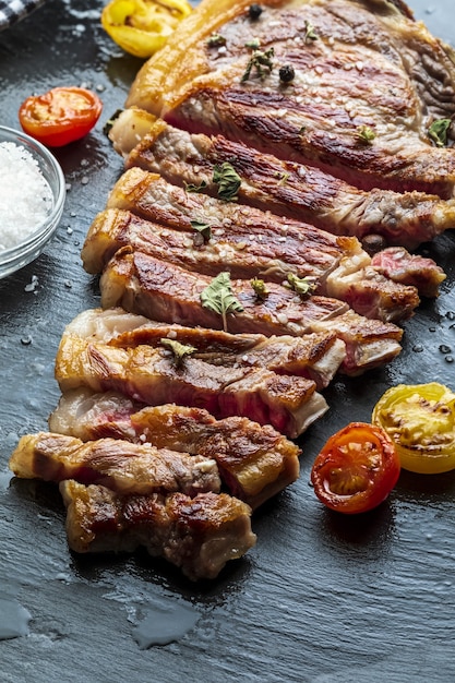 Red beef cutlet (cow, heifer, veal) cooked on the grill. Cut into strips. Top view.