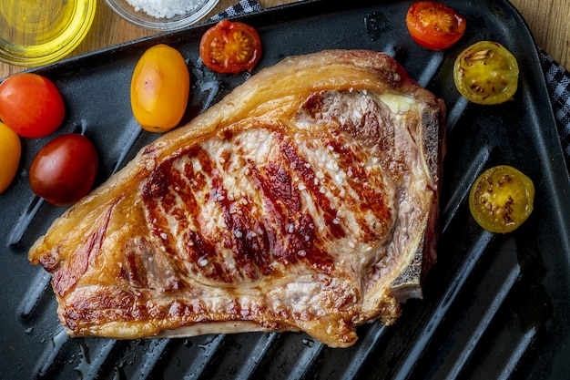 Red beef cutlet (cow, heifer, veal) cooked on the grill. Top view.