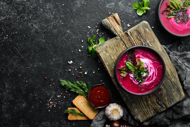 Red beet soup with sour cream Ukrainian cuisine Borsch soup Top view Free space for your text Rustic style