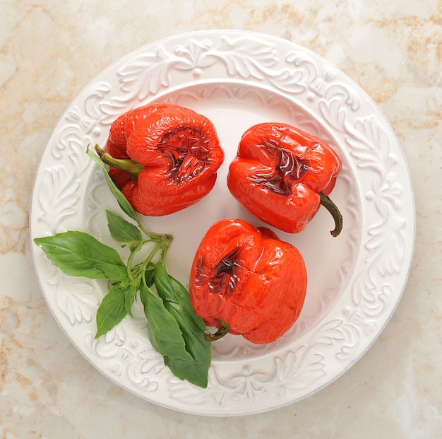 Red bell pepper and cherry tomatoes roasted on the grill