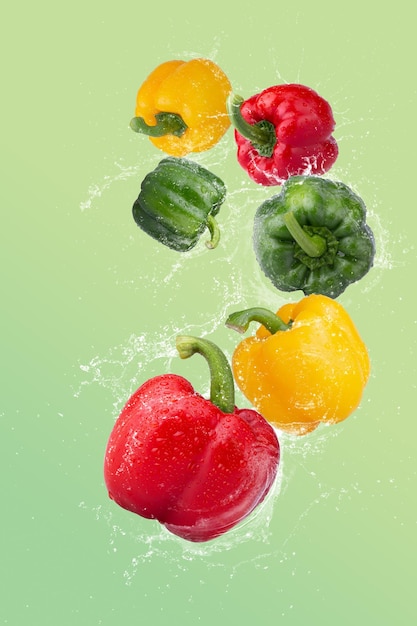 Red Bell Pepper Green Bell Pepper and Yellow Bell Pepper on a Green background