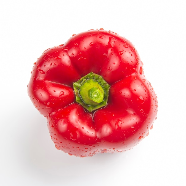 Red bell pepper on top on a white background. vitamins and vegetables
