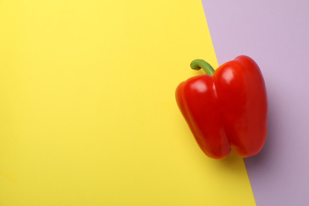 Red bell pepper on two color background