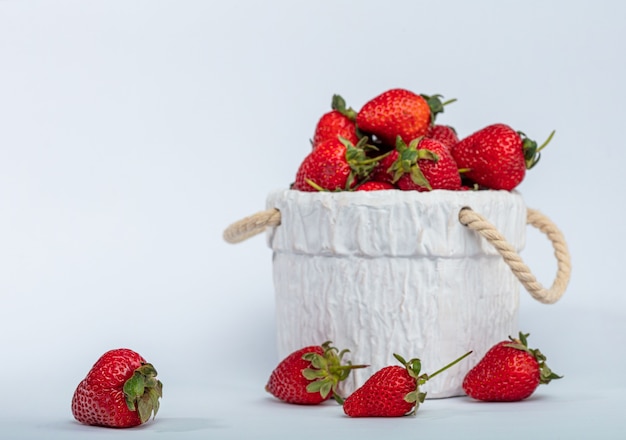 Red berry strawberry in white ceramic plate