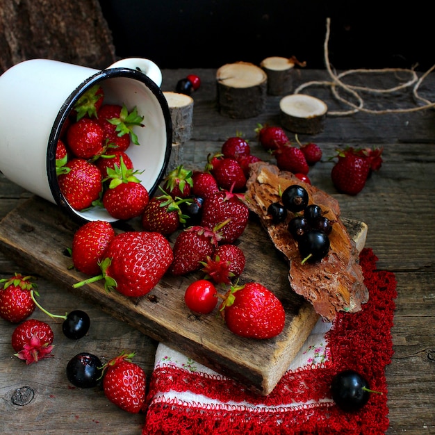 Red berry strawberry, wooden rustic background. Organic natural products.