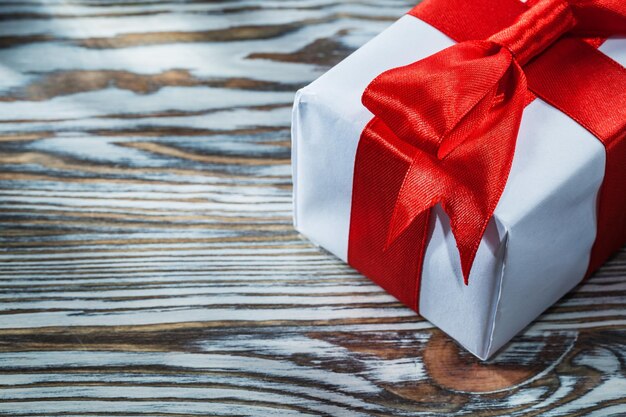 Red birthday gift box on wooden background