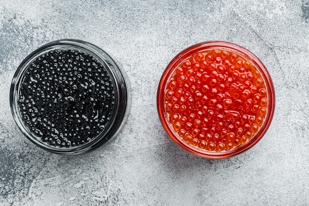 Red and black caviar in glass bowl