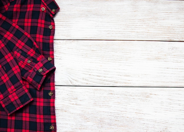  red black checkered shirt on a table