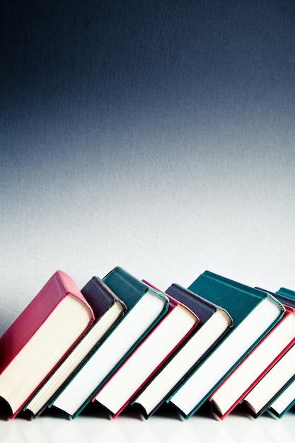 Red black and green books in a library