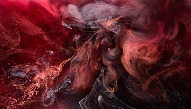Red black pigment swirling ink abstract background, liquid smoke paint underwater