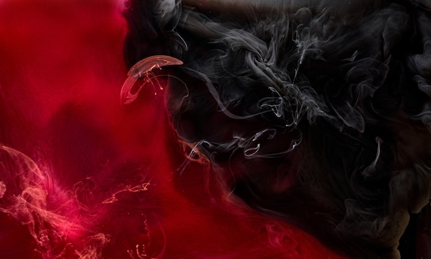 Red black pigment swirling ink abstract background, liquid smoke paint underwater