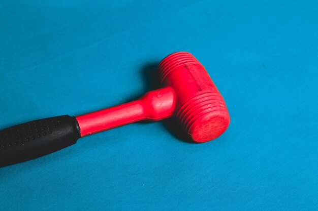 red and black rubber hammer