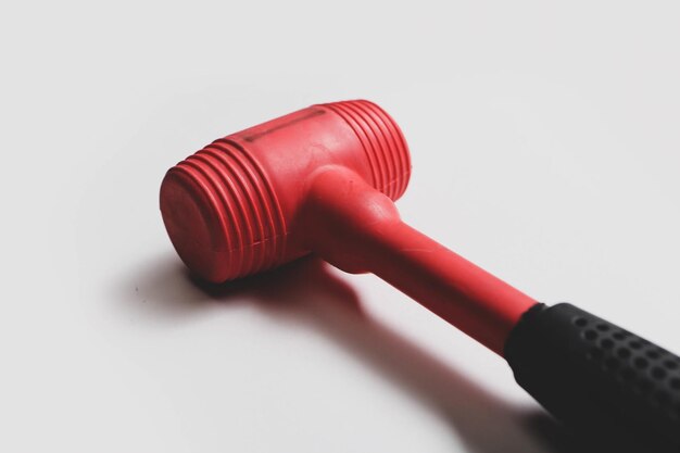 red and black rubber hammer