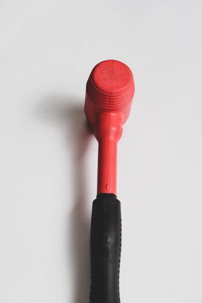 red and black rubber hammer