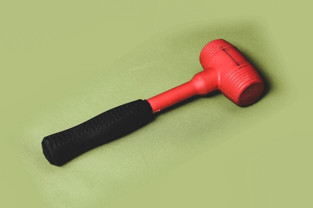 Photo red and black rubber hammer