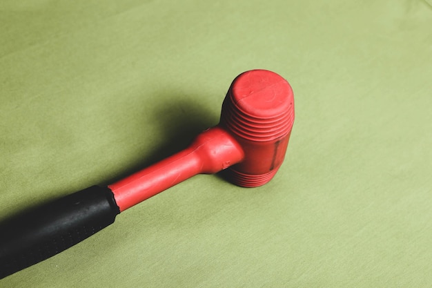 red and black rubber hammer