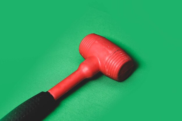 red and black rubber hammer