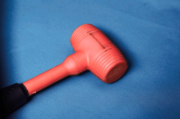 red and black rubber hammer