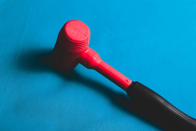 red and black rubber hammer