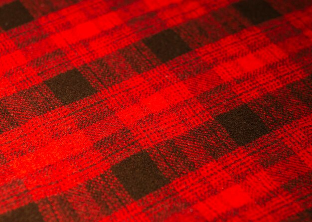 Photo a red and black tartan fabric with a black square pattern.