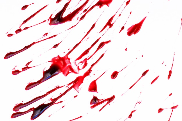 Red blood splattered on a white surface