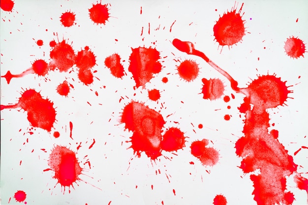 Red blots and spots on a white background