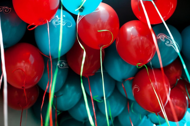 red and blue balloons under the ceiling many red and blue balloons background for a greeting card