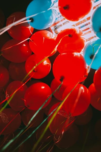 red and blue balloons under the ceiling many red and blue balloons vintage photo processing