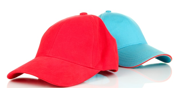 Photo red and blue caps cap on white