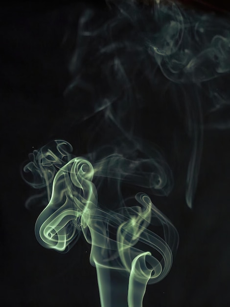 Red and blue cloud of smoke of black isolated background Background from the smoke of vape