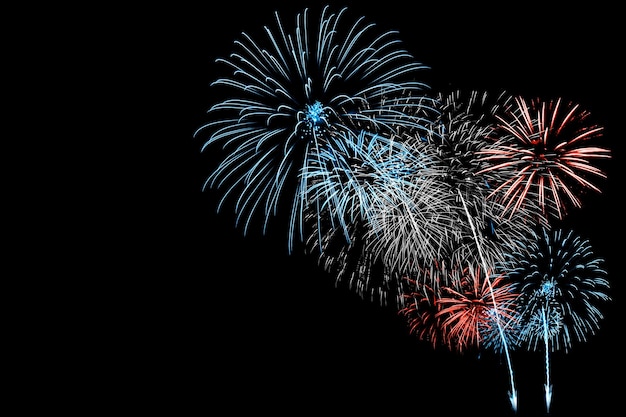 Photo red and blue firework in black background