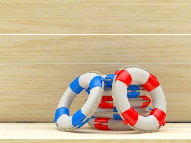 Red and blue lifebuoys on wooden