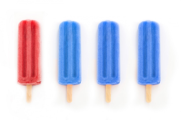 Red and blue popsicles isolated on white Popsicles with colors of United States flag