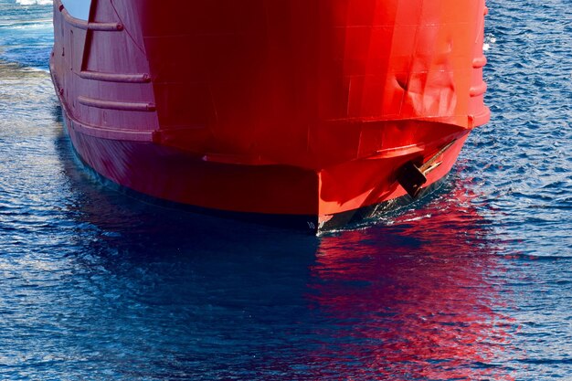 Red boat sailing on sea